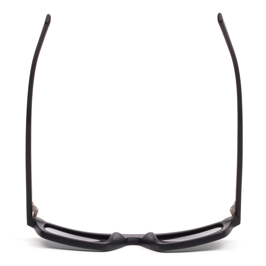 Black sunglasses with dark lenses on a white background
