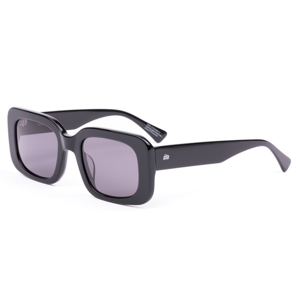 Black sunglasses with gray lenses on a white background