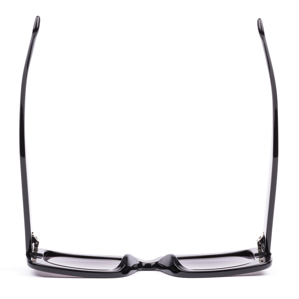 Black sunglasses with gray lenses on a white background