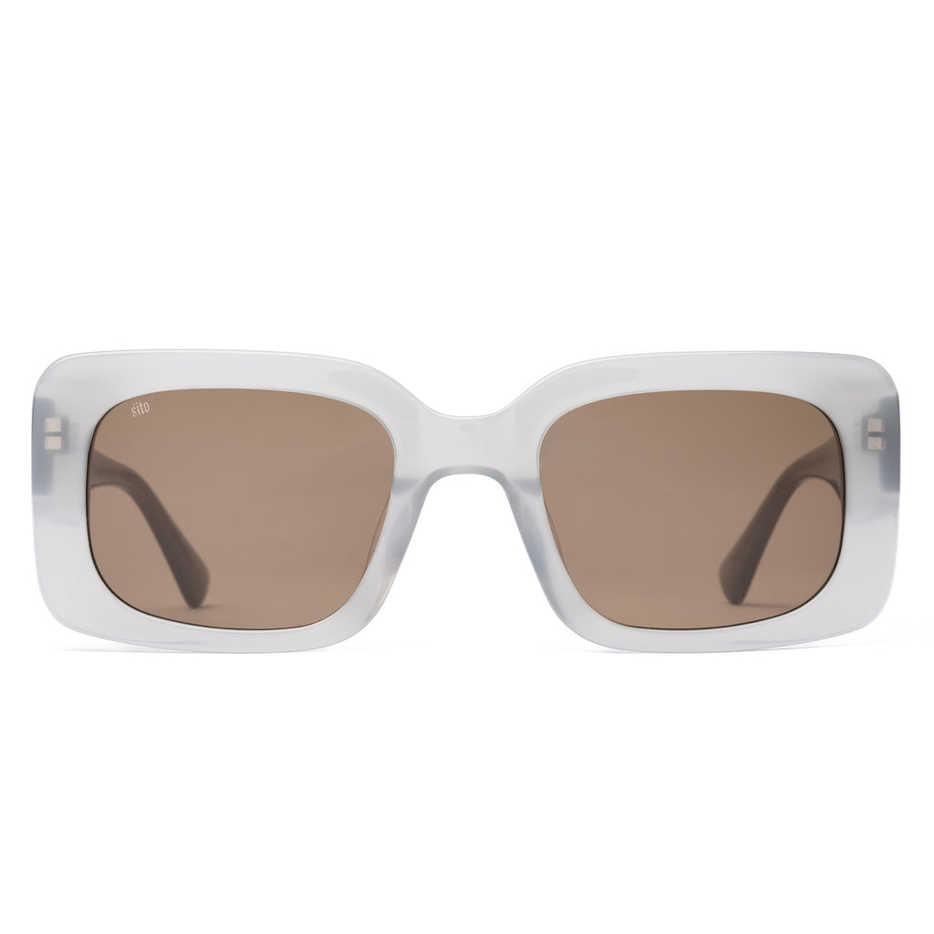 White sunglasses with brown lenses on a white background