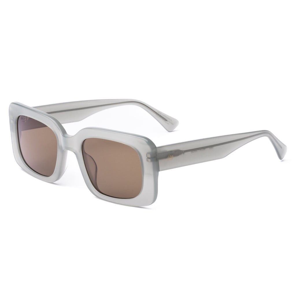 White sunglasses with brown lenses on a white background