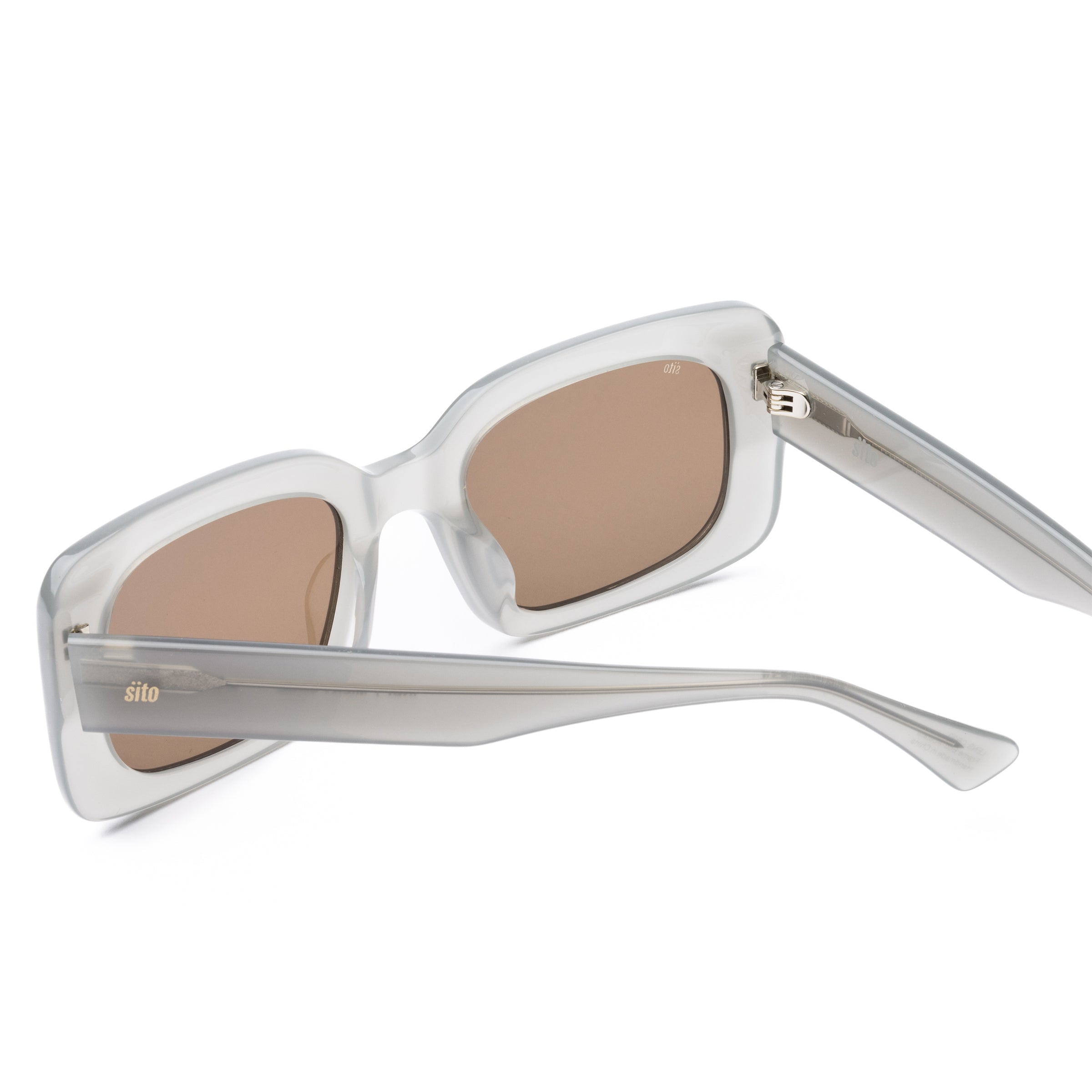 White sunglasses with brown lenses on a white background