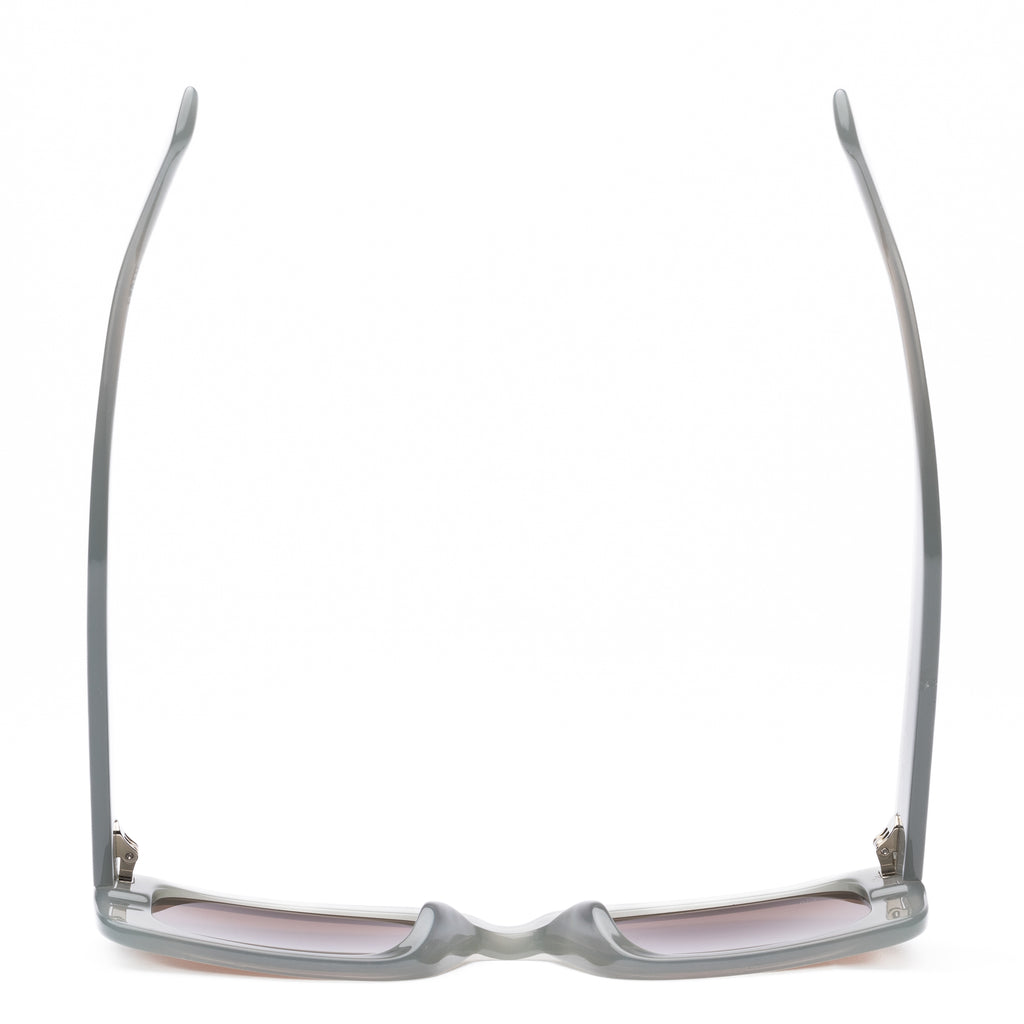 White sunglasses with brown lenses on a white background