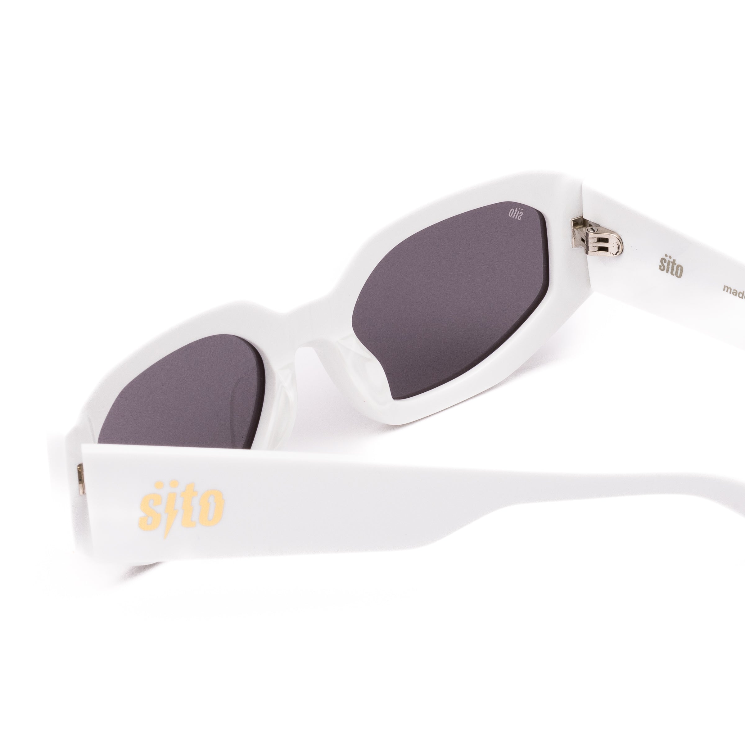 White sunglasses with dark lenses on a white background
