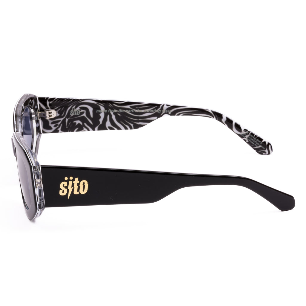 Sunglasses with black and white patterned arms and 'sifto' branding on a white background
