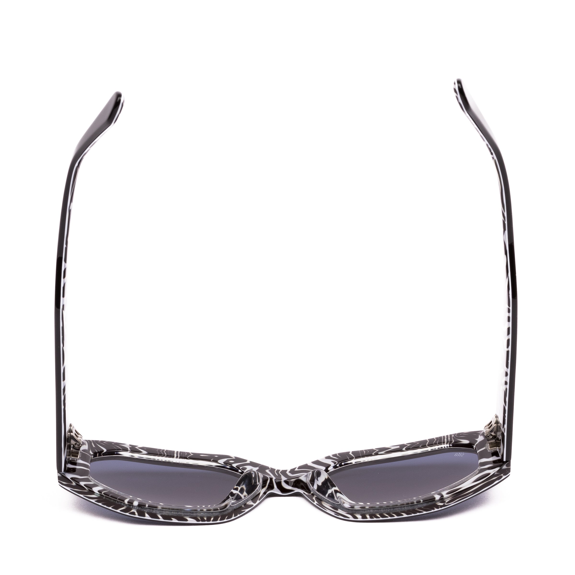 Sunglasses with black and white patterned frames on a white background