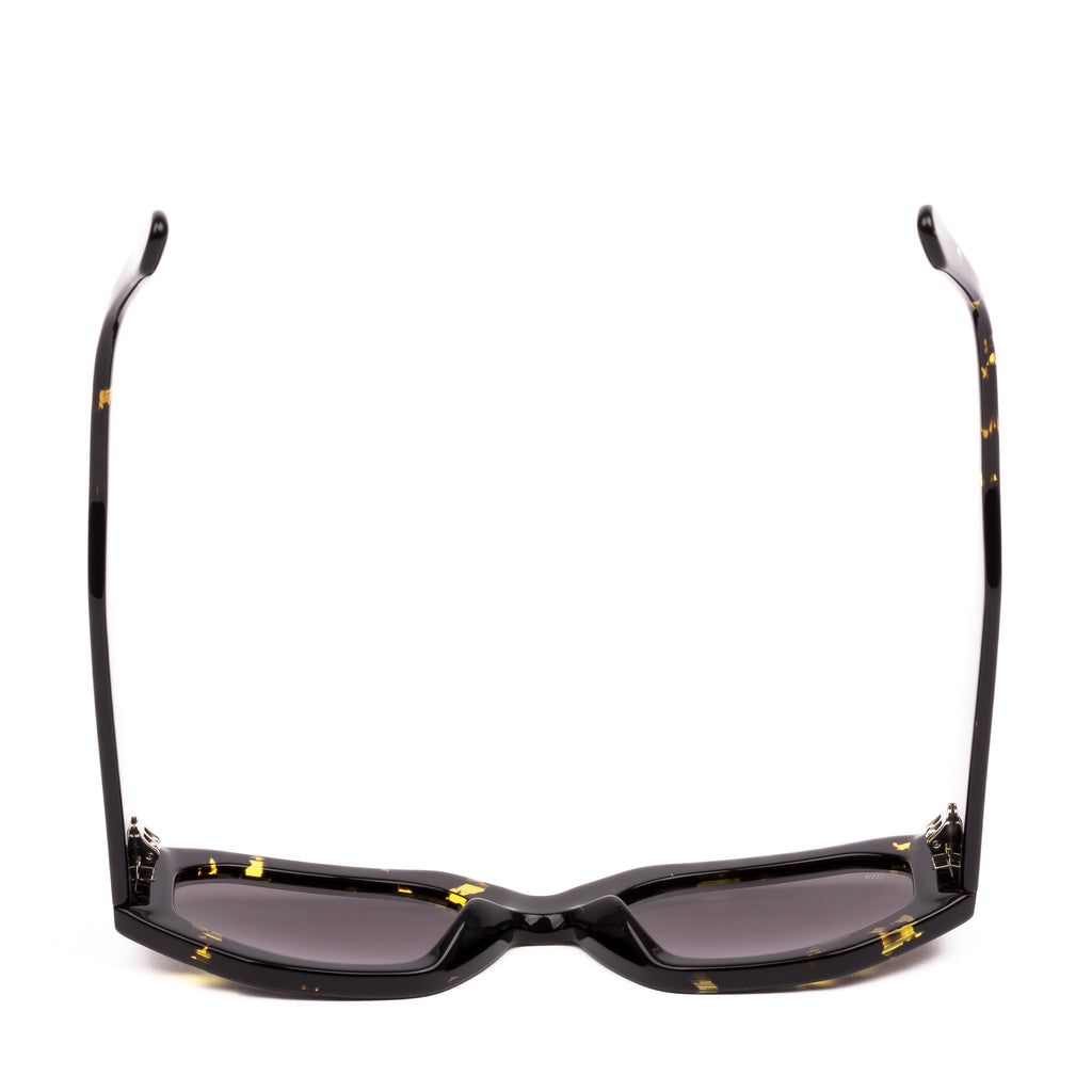 Sunglasses with black frame and yellow accents on a white background