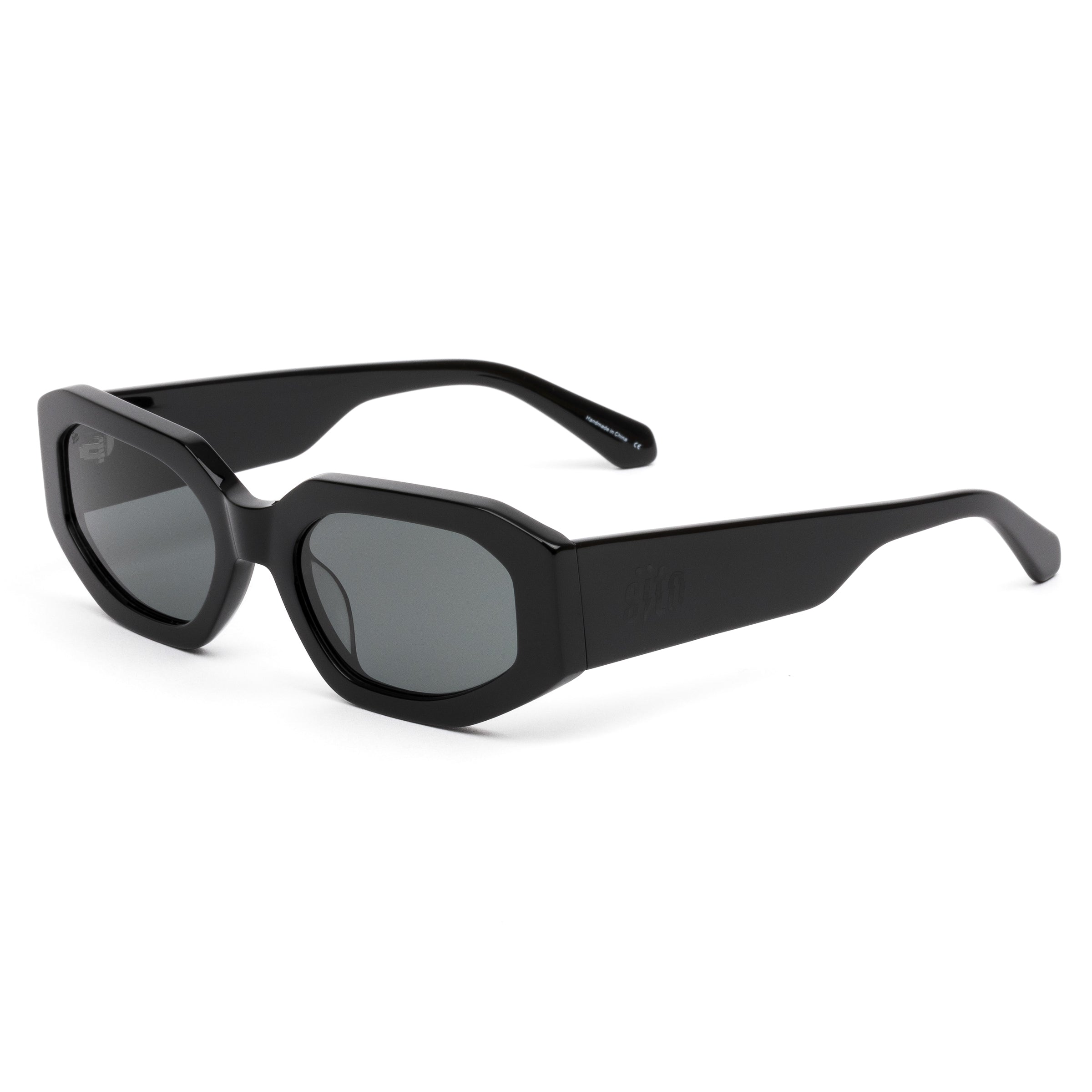 Black sunglasses with gray lenses on a white background
