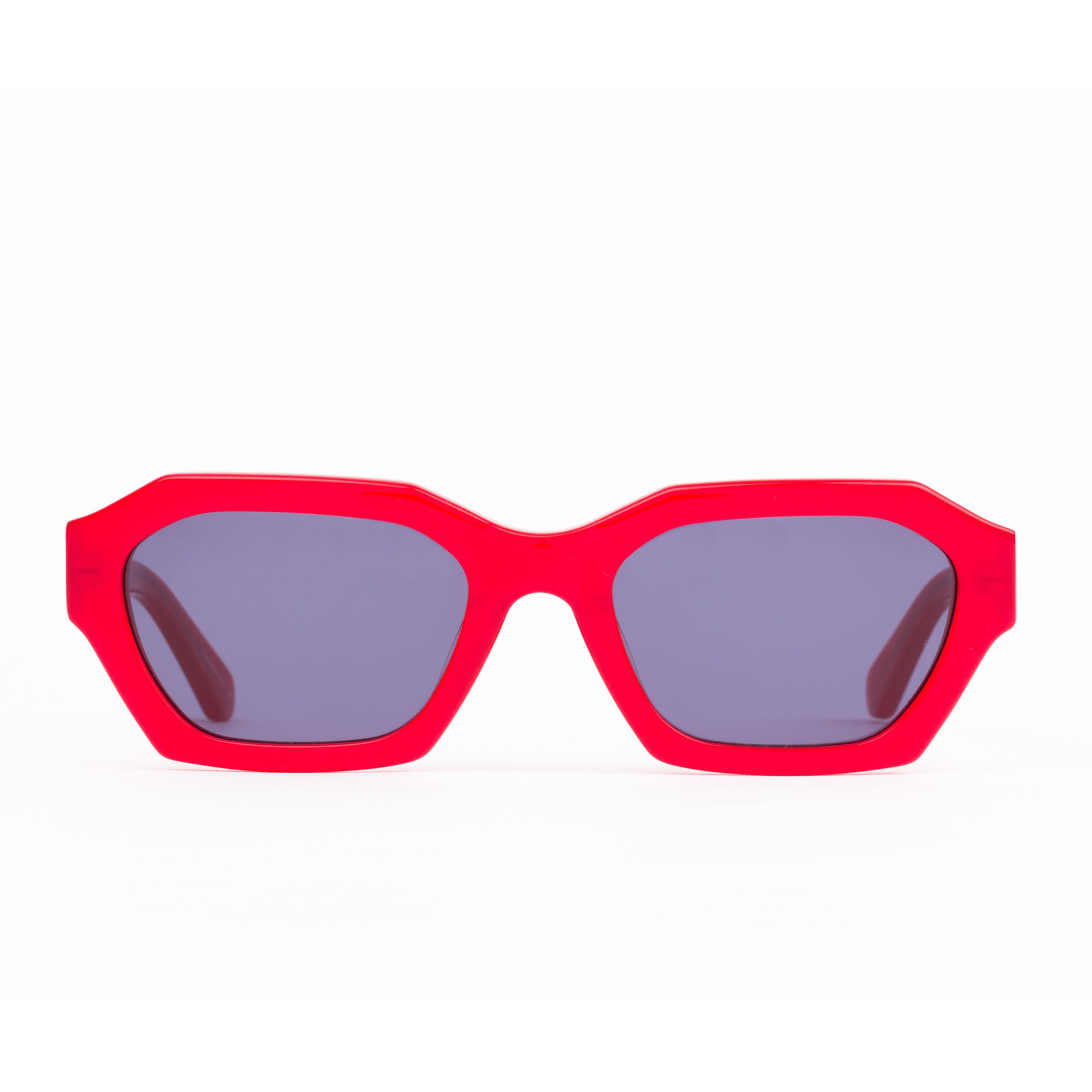 Red sunglasses with dark lenses on a white background
