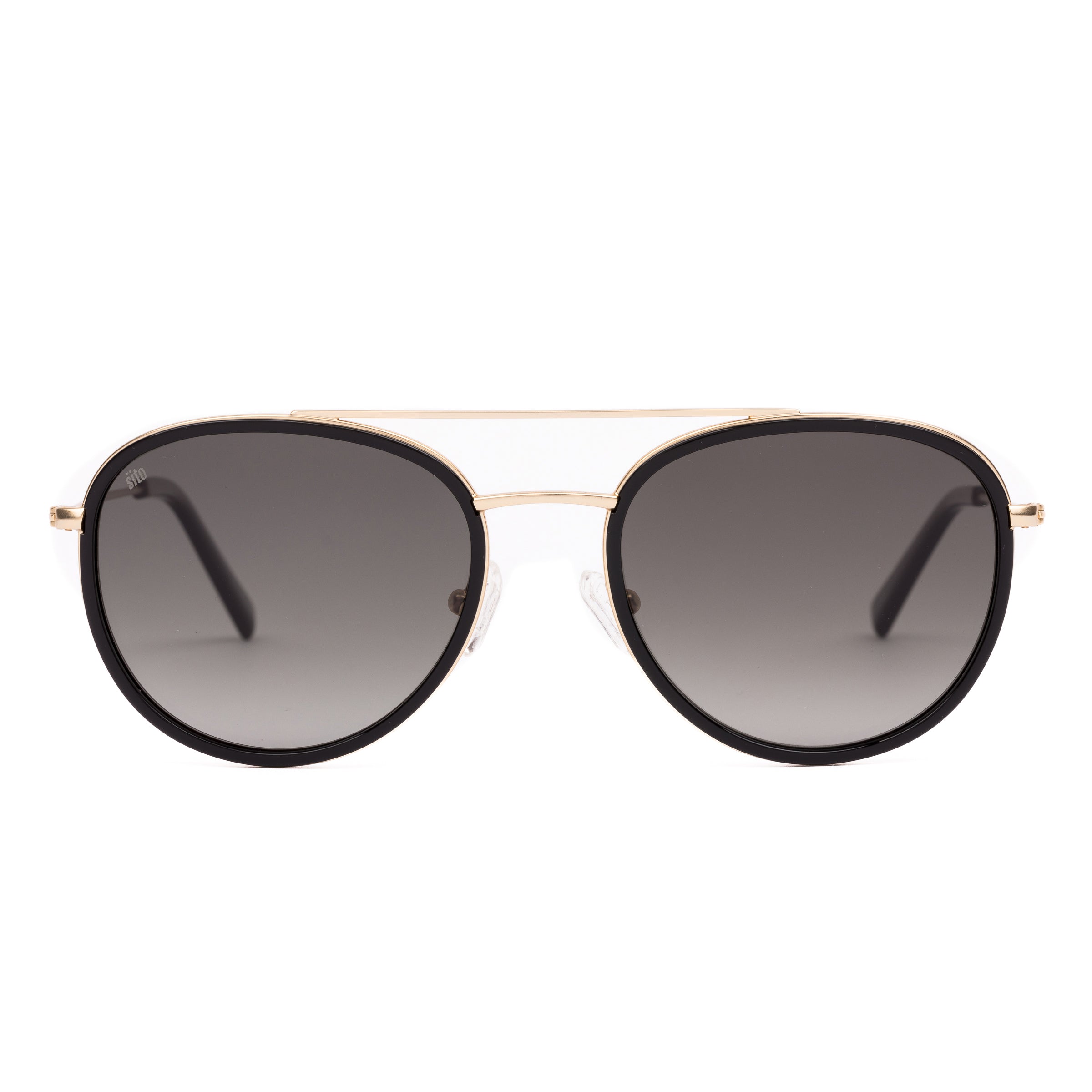 Sunglasses with gold frame and dark lenses on a white background