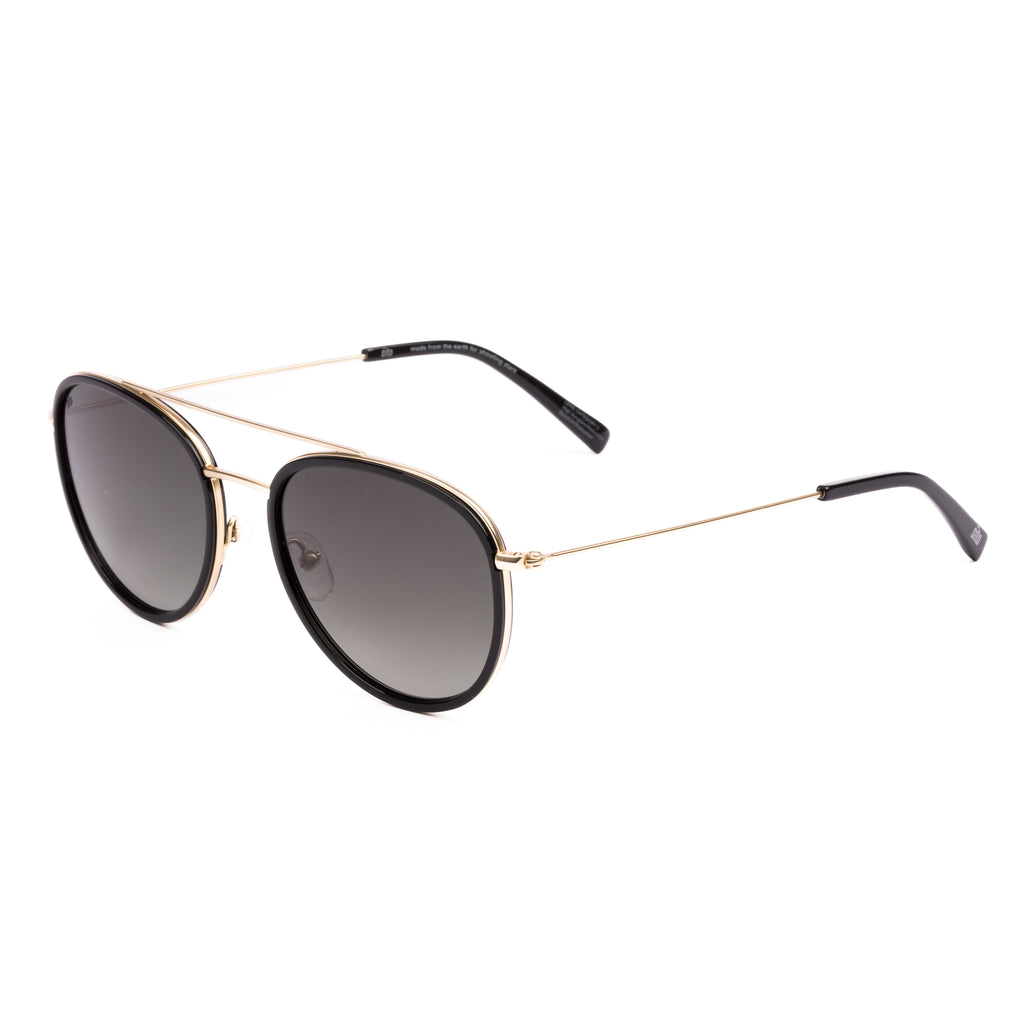 Sunglasses with gold frame and dark lenses on a white background