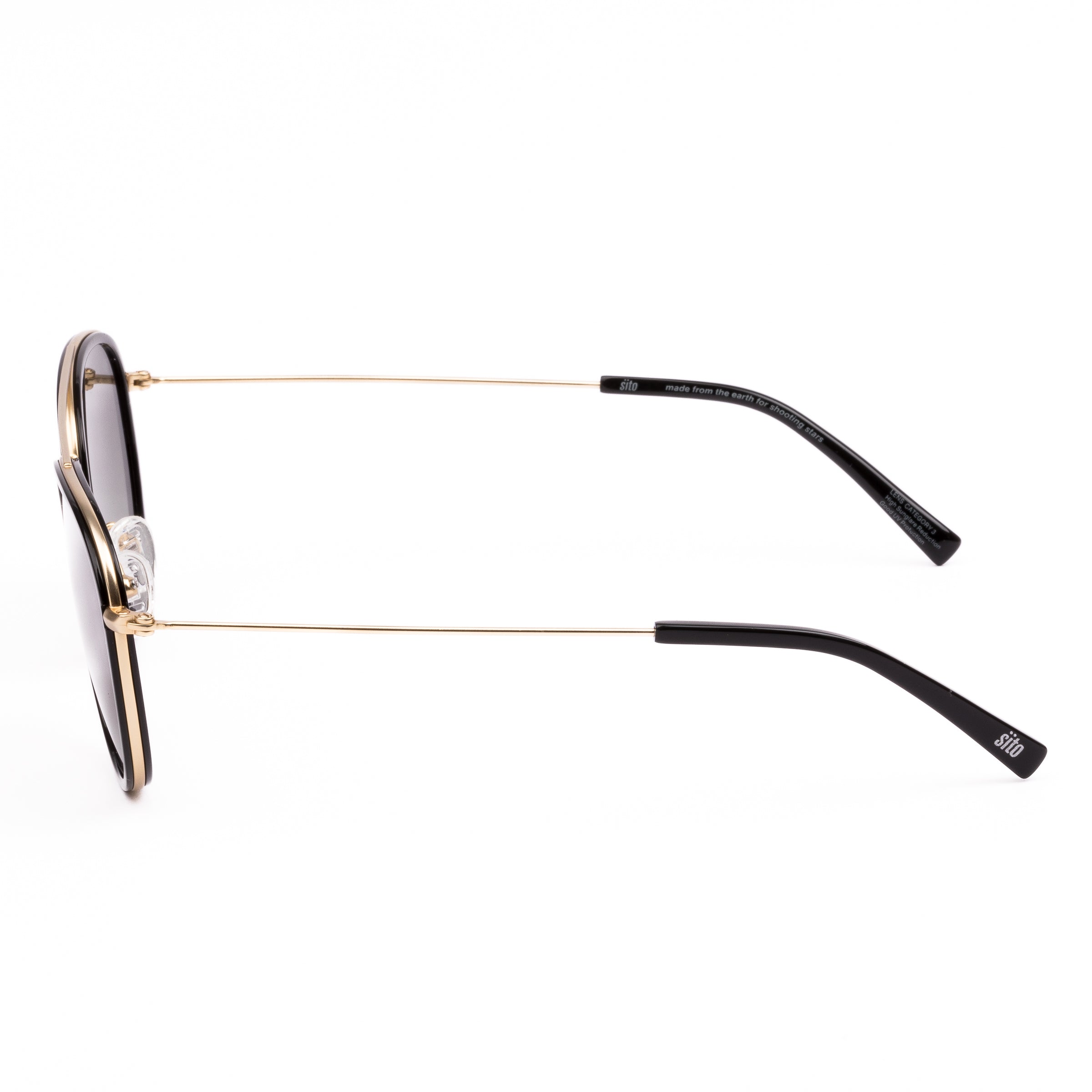 Sunglasses with gold frame and dark lenses on a white background