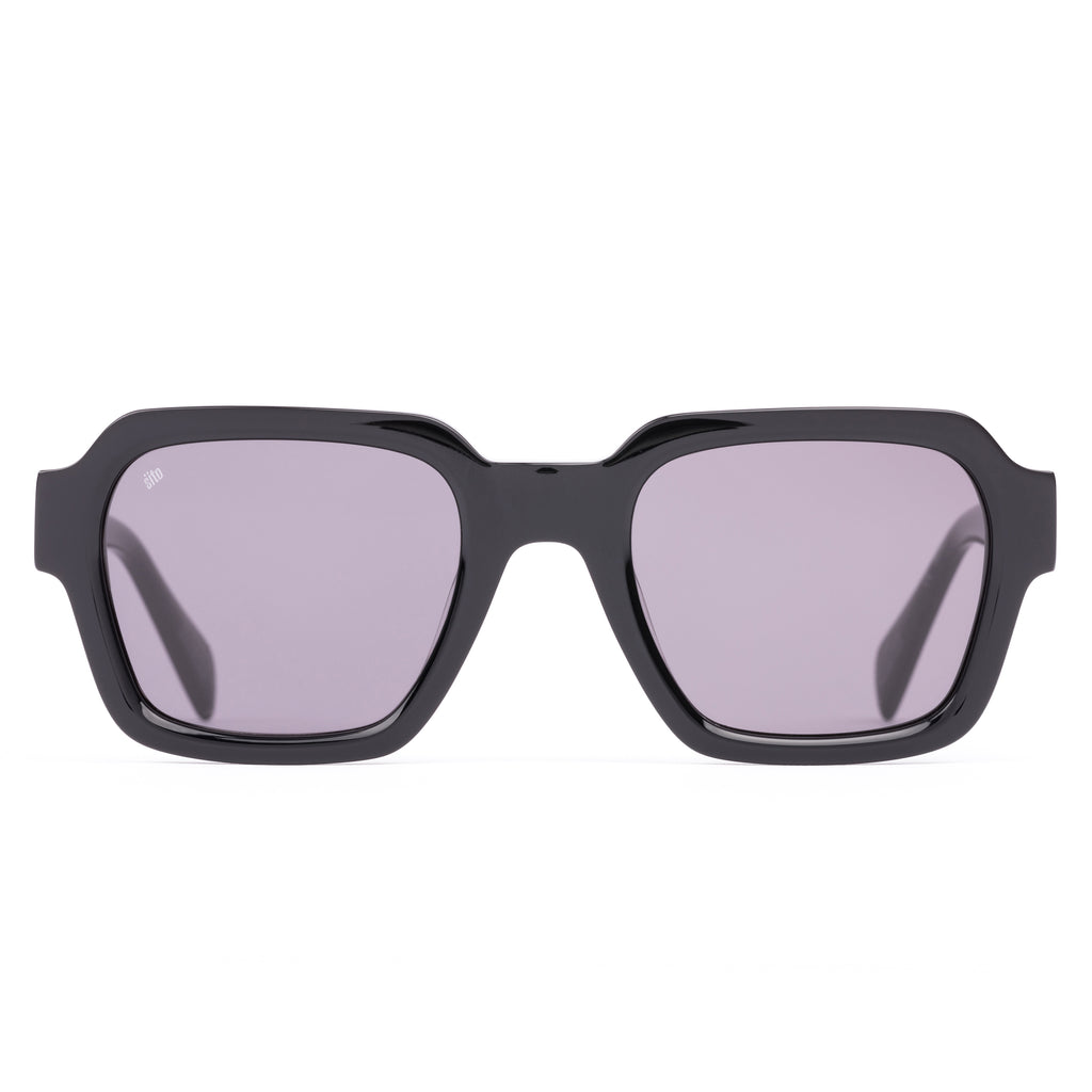 Black sunglasses with a glossy black finish and softly tinted lenses.