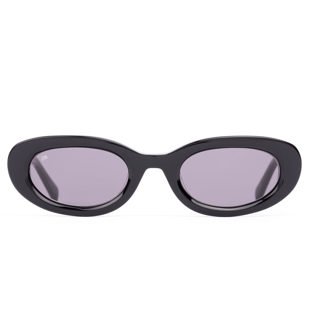 Black sunglasses with purple lenses on a white background