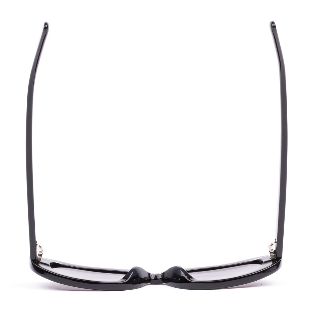 Black sunglasses with purple lenses on a white background