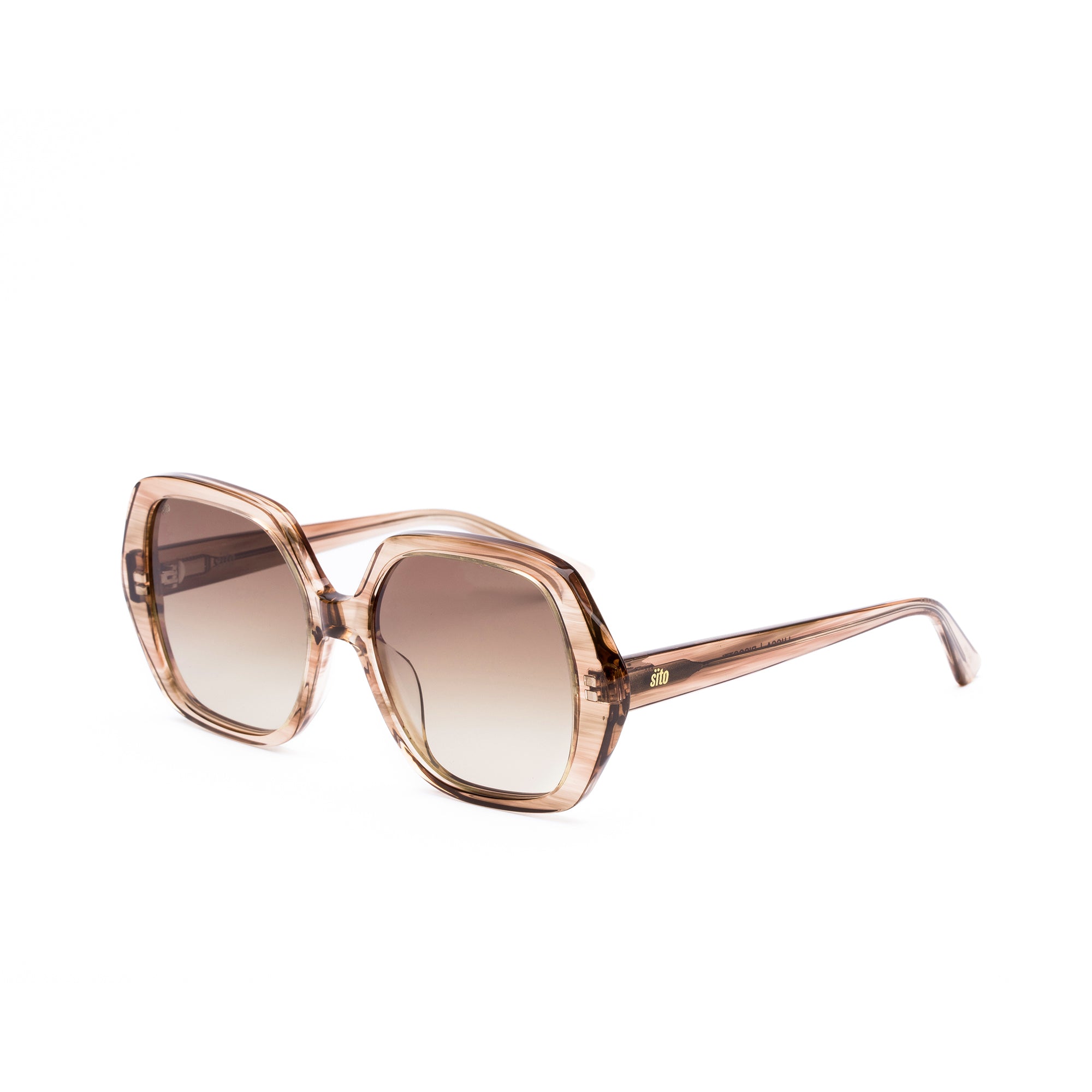 Sunglasses with rose gold frame and gradient lenses on a white background