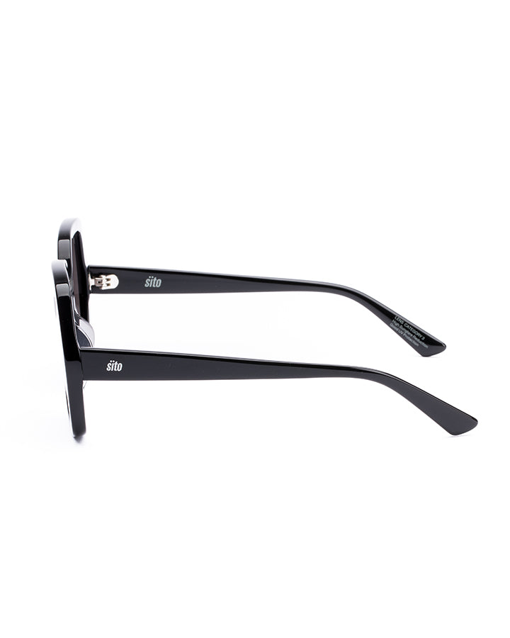 Black sunglasses with reflective lenses on a white background