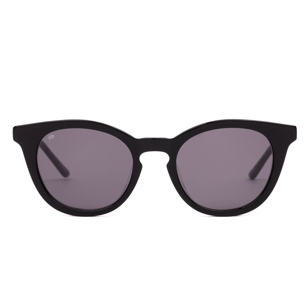 Black sunglasses with dark lenses on a white background