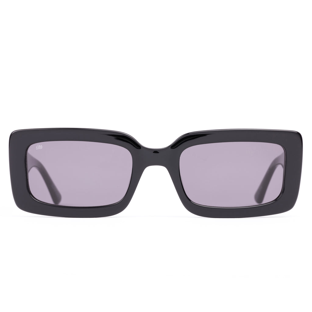 Black sunglasses with gray lenses on a white background