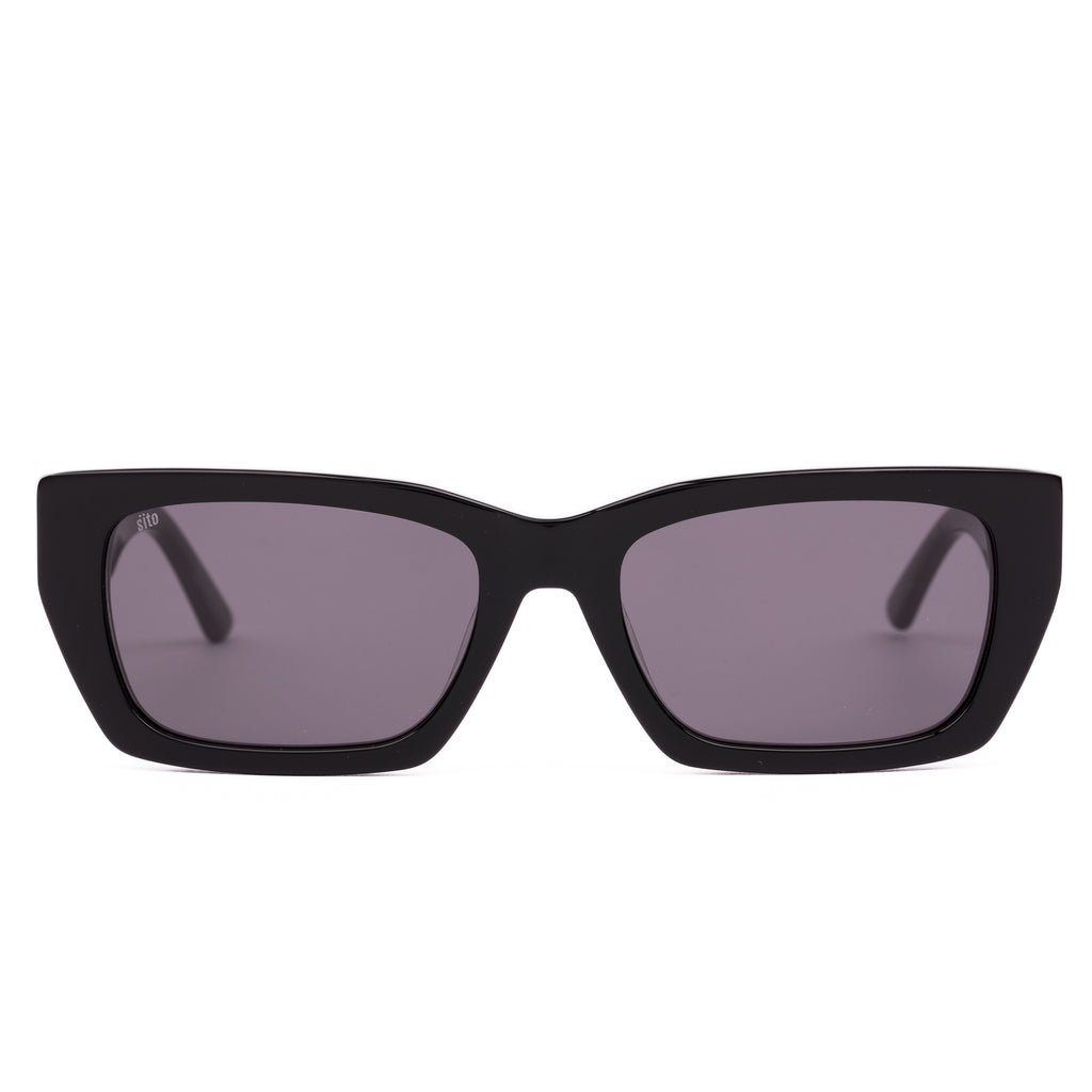 Black sunglasses with dark lenses on a white background