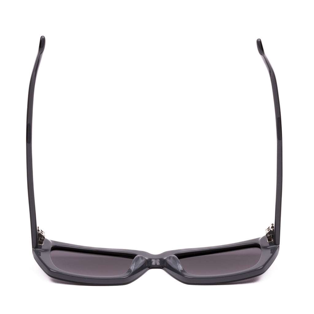 Sunglasses with black frames and dark lenses on a white background
