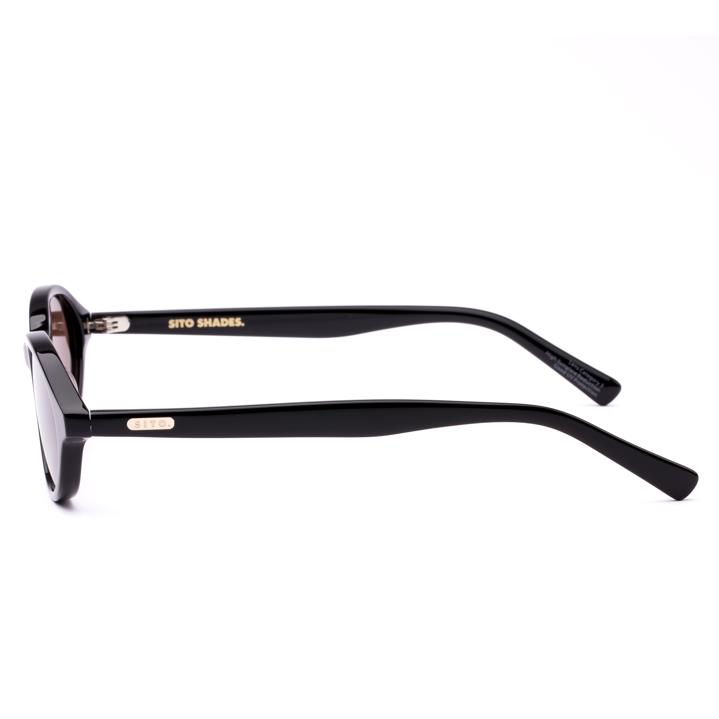 Black sunglasses with brown lenses on a white background