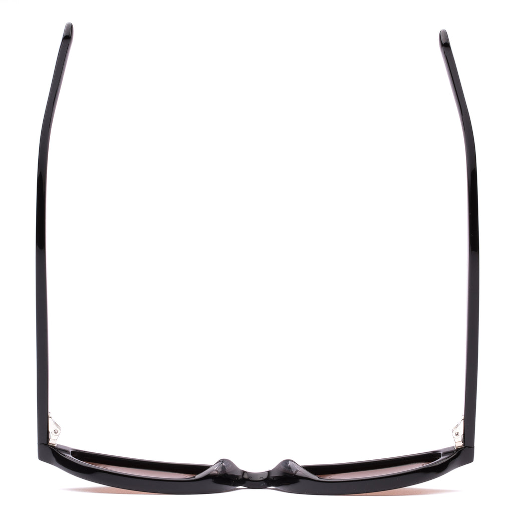 Black sunglasses with brown lenses on a white background