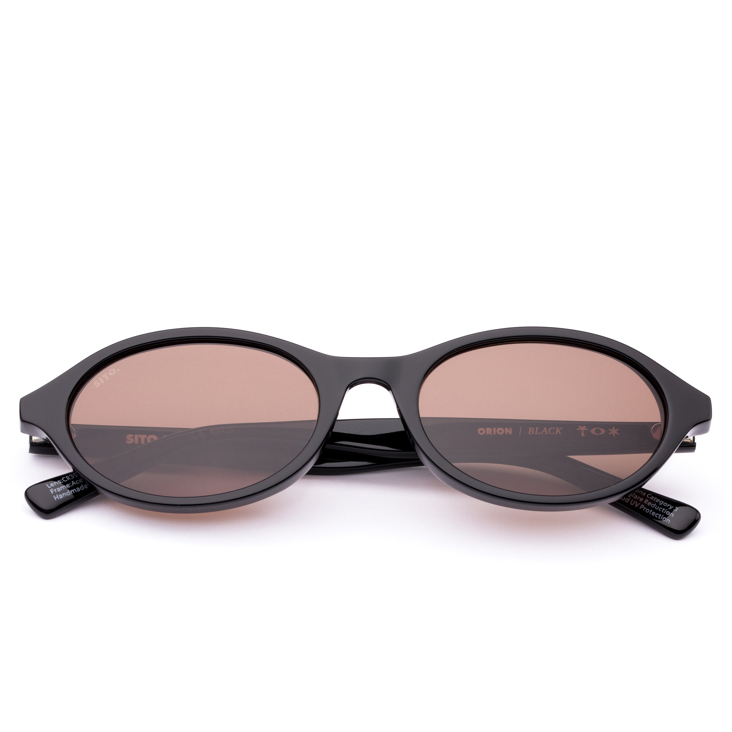 Black sunglasses with brown lenses on a white background