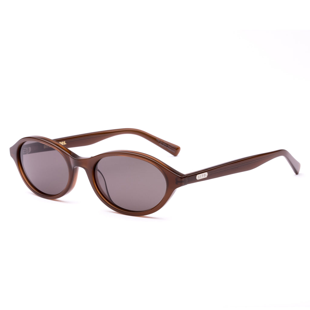 Brown sunglasses with a reflective lens on a white background