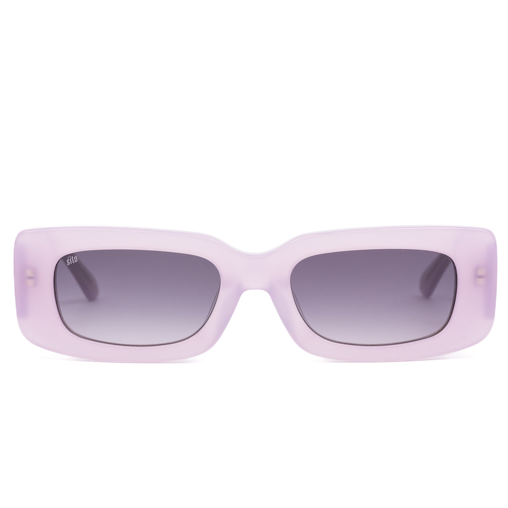 Pink sunglasses with dark lenses on a white background