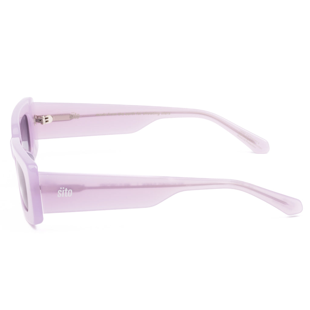 Pink sunglasses with dark lenses on a white background