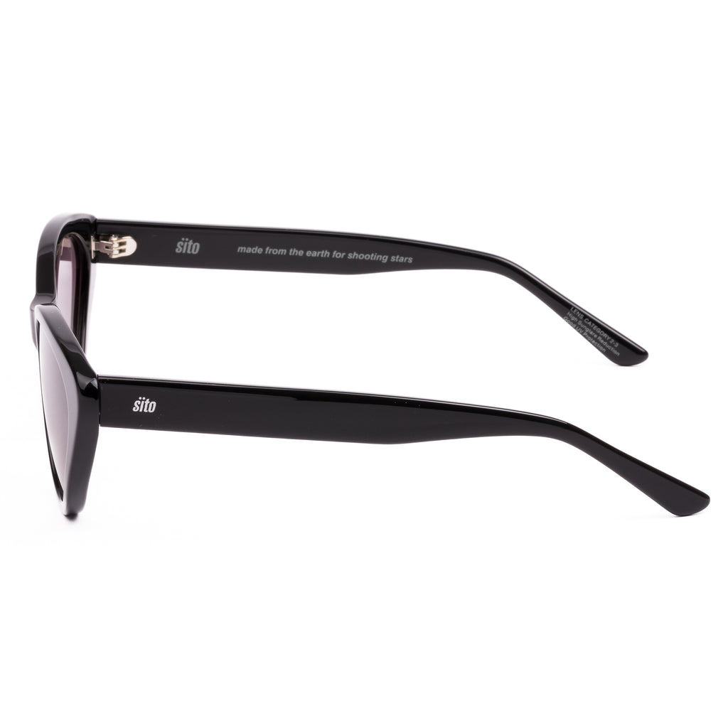 Black cat-eye sunglasses with pink gradient lenses on a white background