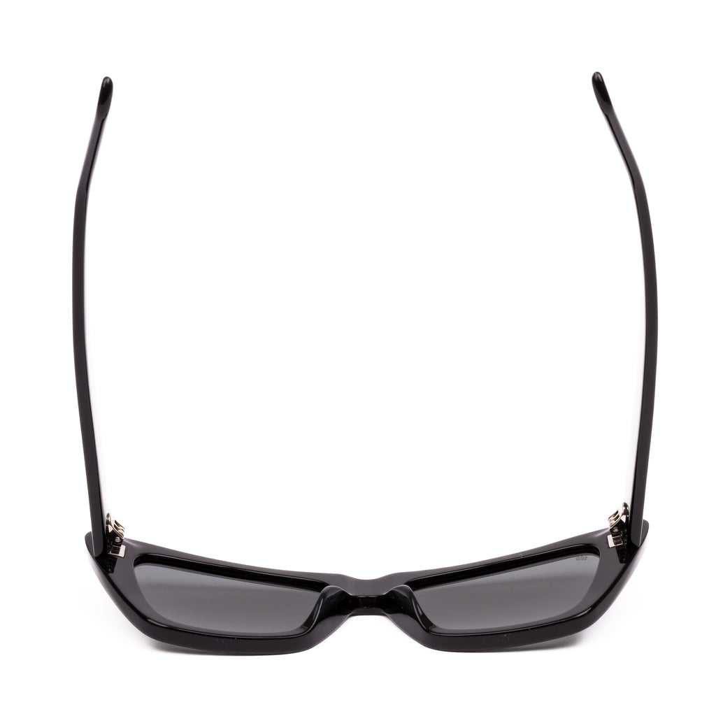 Black cat-eye sunglasses with dark lenses on a white background