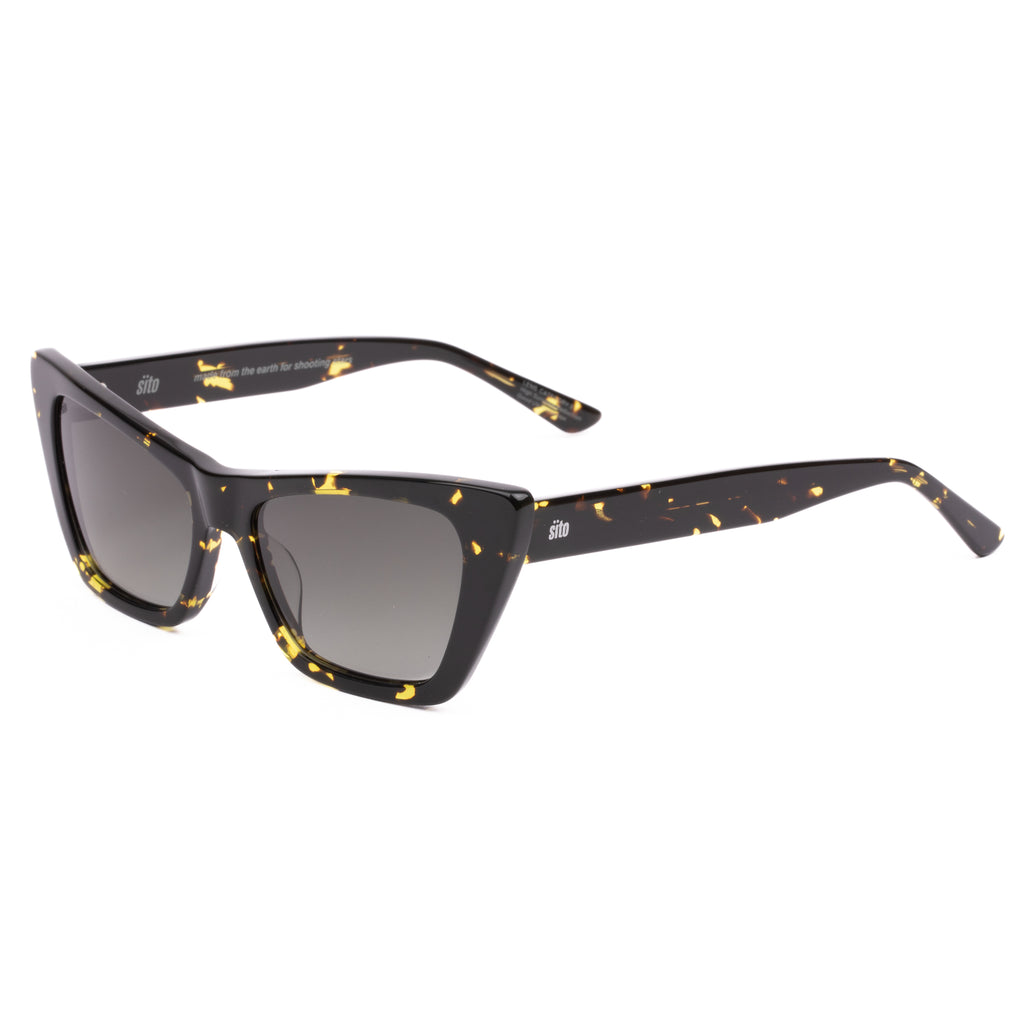 Cat-eye sunglasses with black frame and yellow accents on a white background