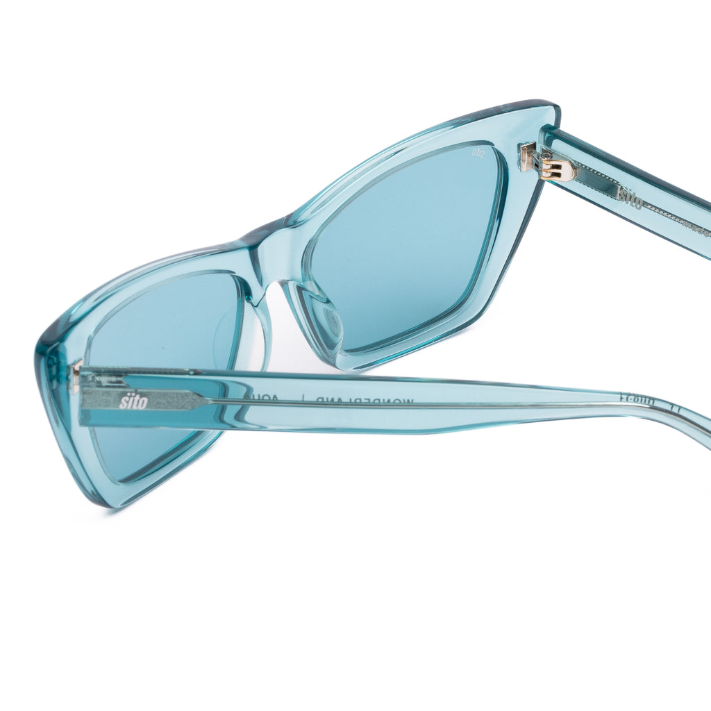 Aqua blue sunglasses with a clear frame on a white background