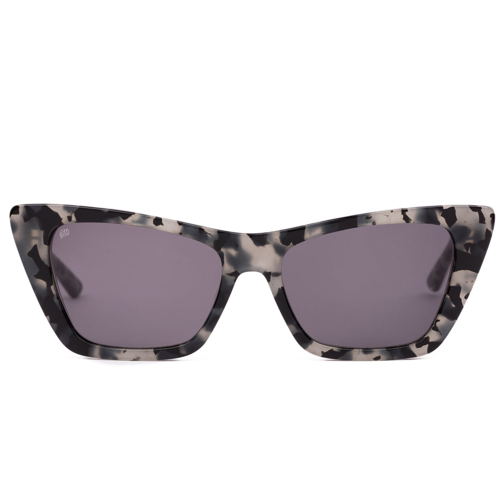 Cat-eye sunglasses with a tortoiseshell frame on a white background