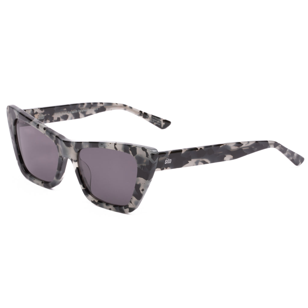 Cat-eye sunglasses with a tortoiseshell frame on a white background