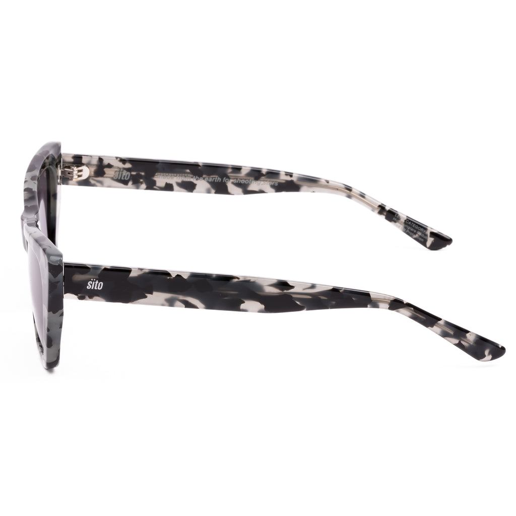 Cat-eye sunglasses with a tortoiseshell frame on a white background