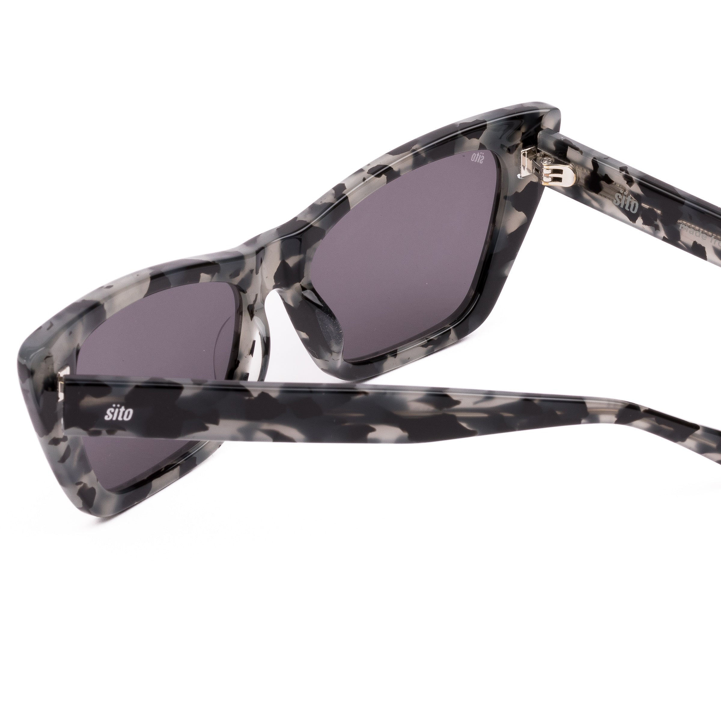 Cat-eye sunglasses with a tortoiseshell frame on a white background