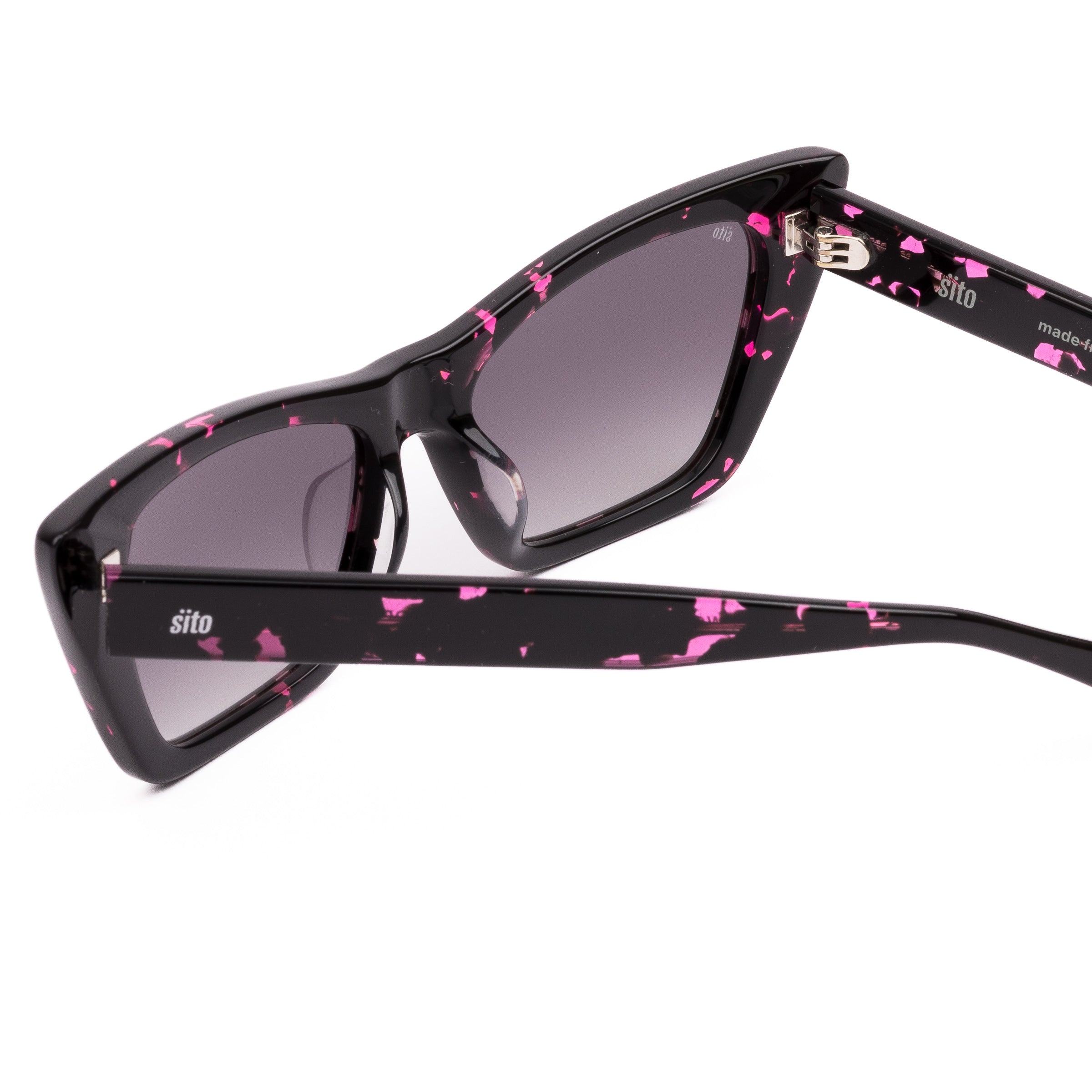 Black cat-eye sunglasses with pink patterns on a white background