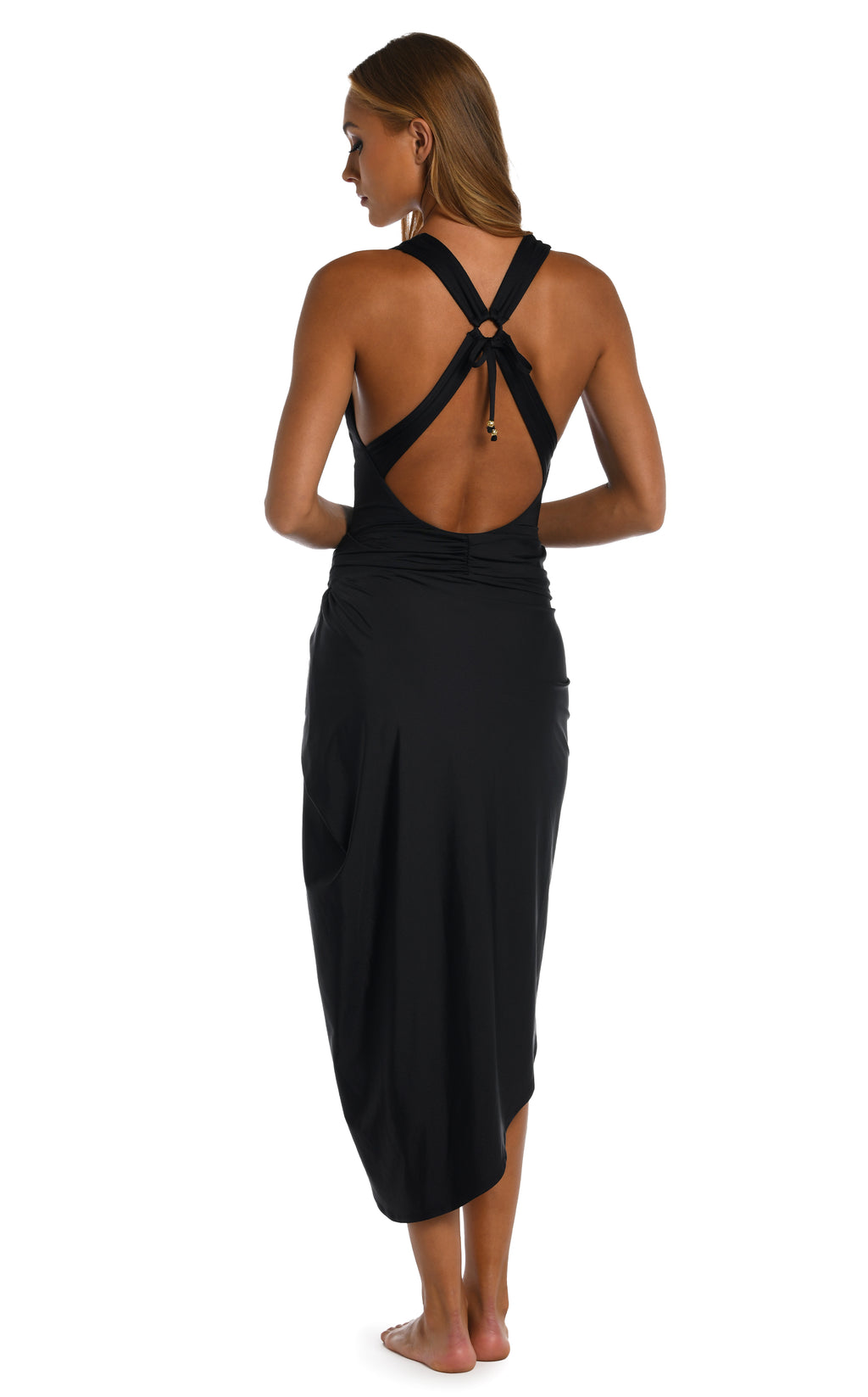 Woman wearing a black bikini and black pareo wrap on a white background