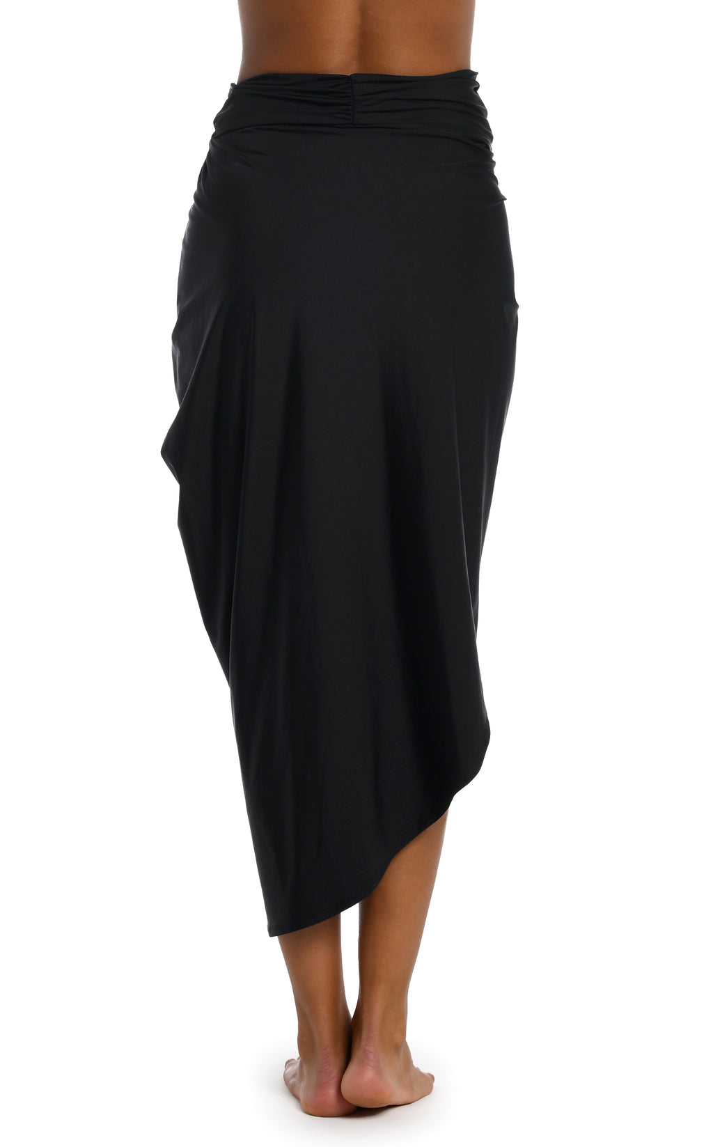 Black pareo wrap worn by a person on a white background