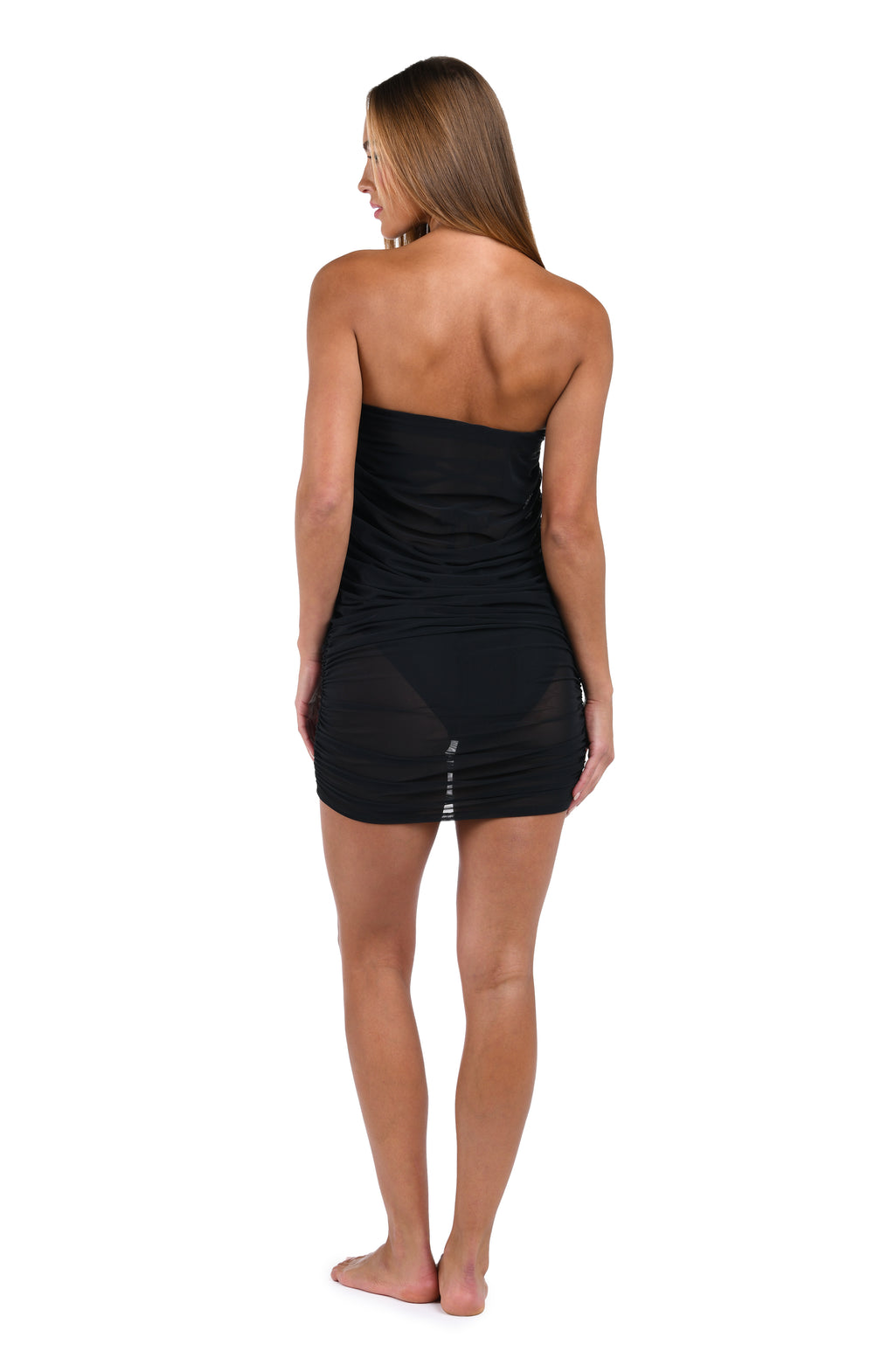 Woman wearing a black black sarong on a white background
