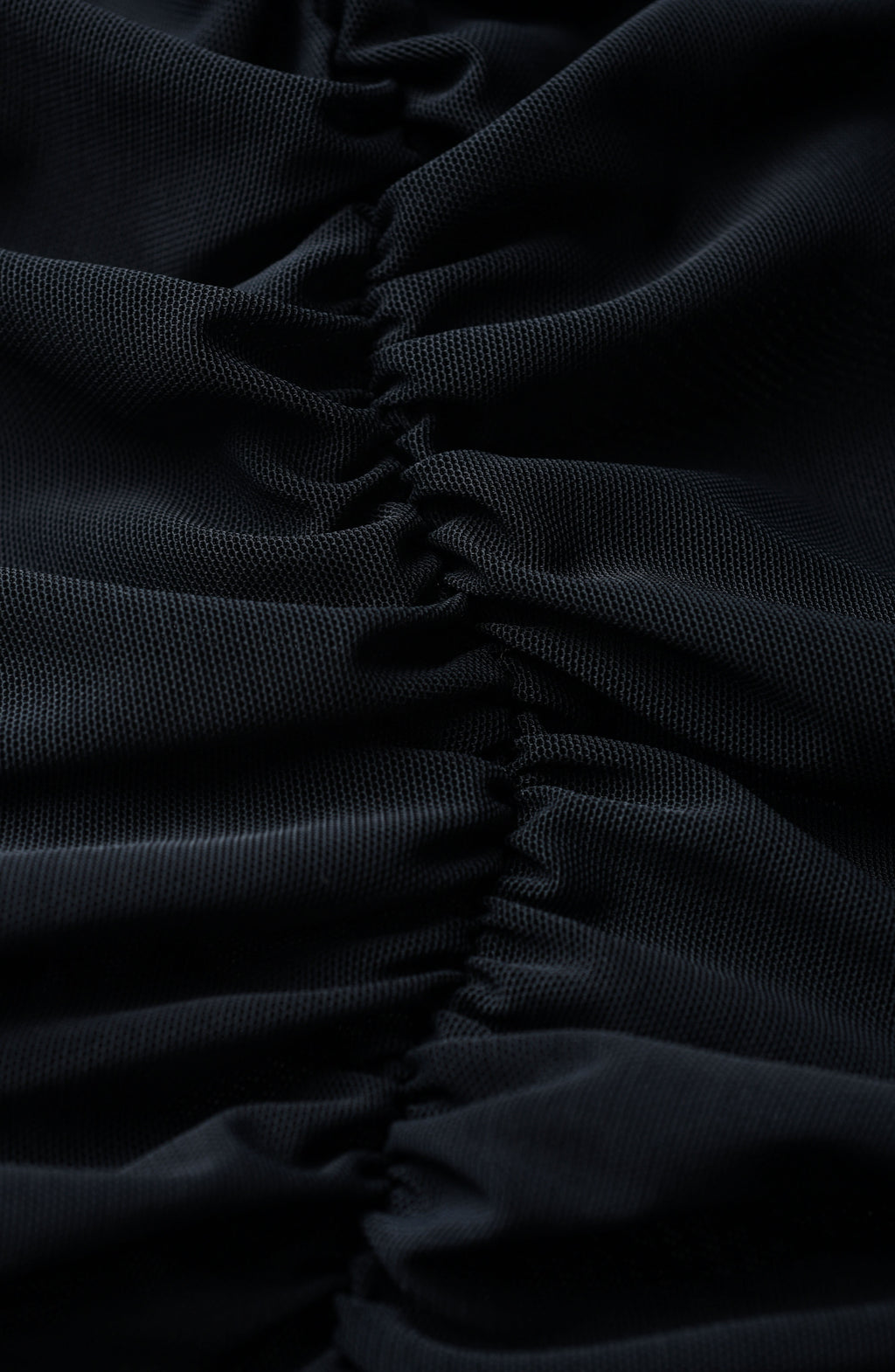 Close-up image of ruched black fabric