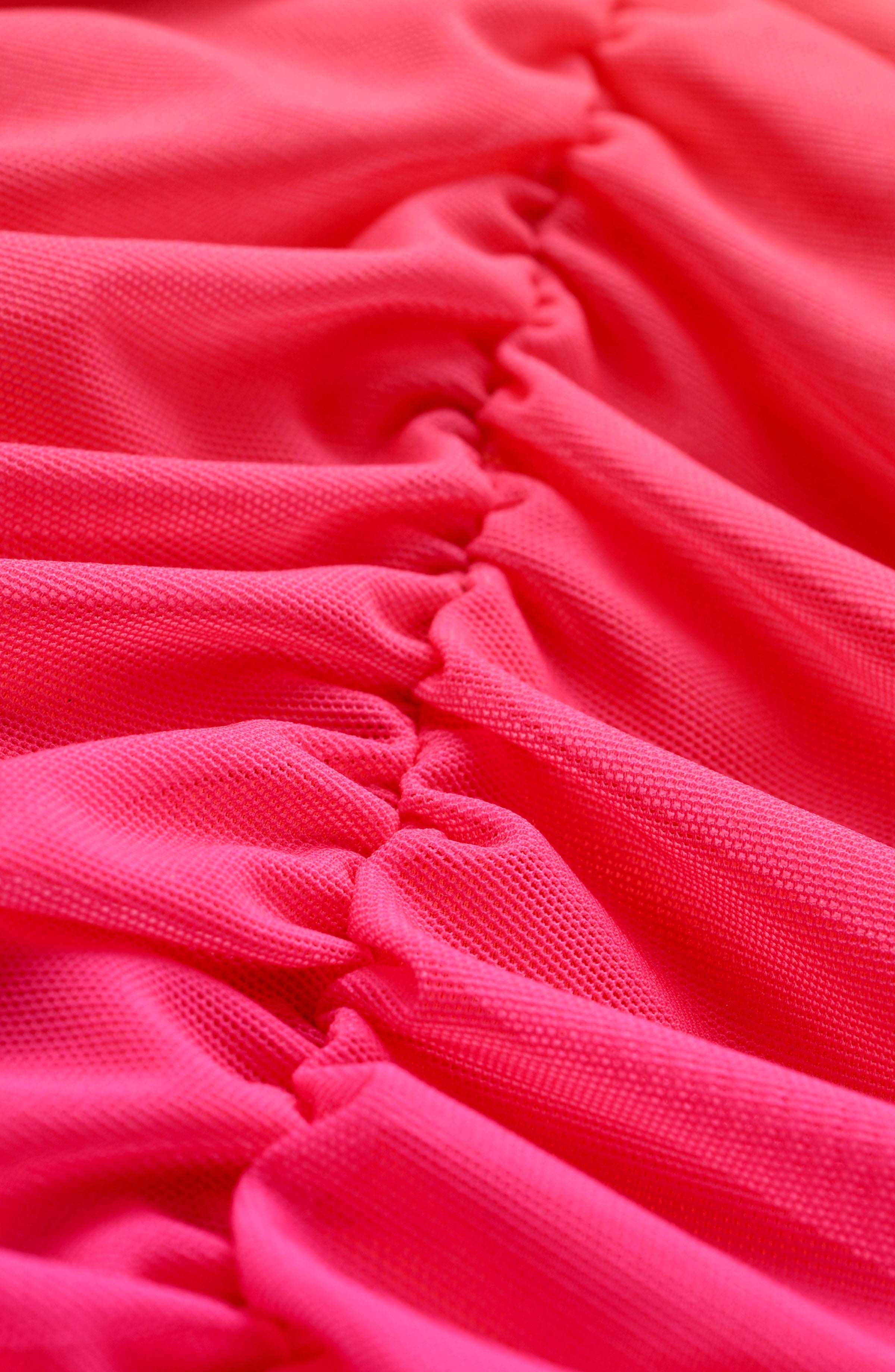 Close-up of pink fabric with ruffled texture