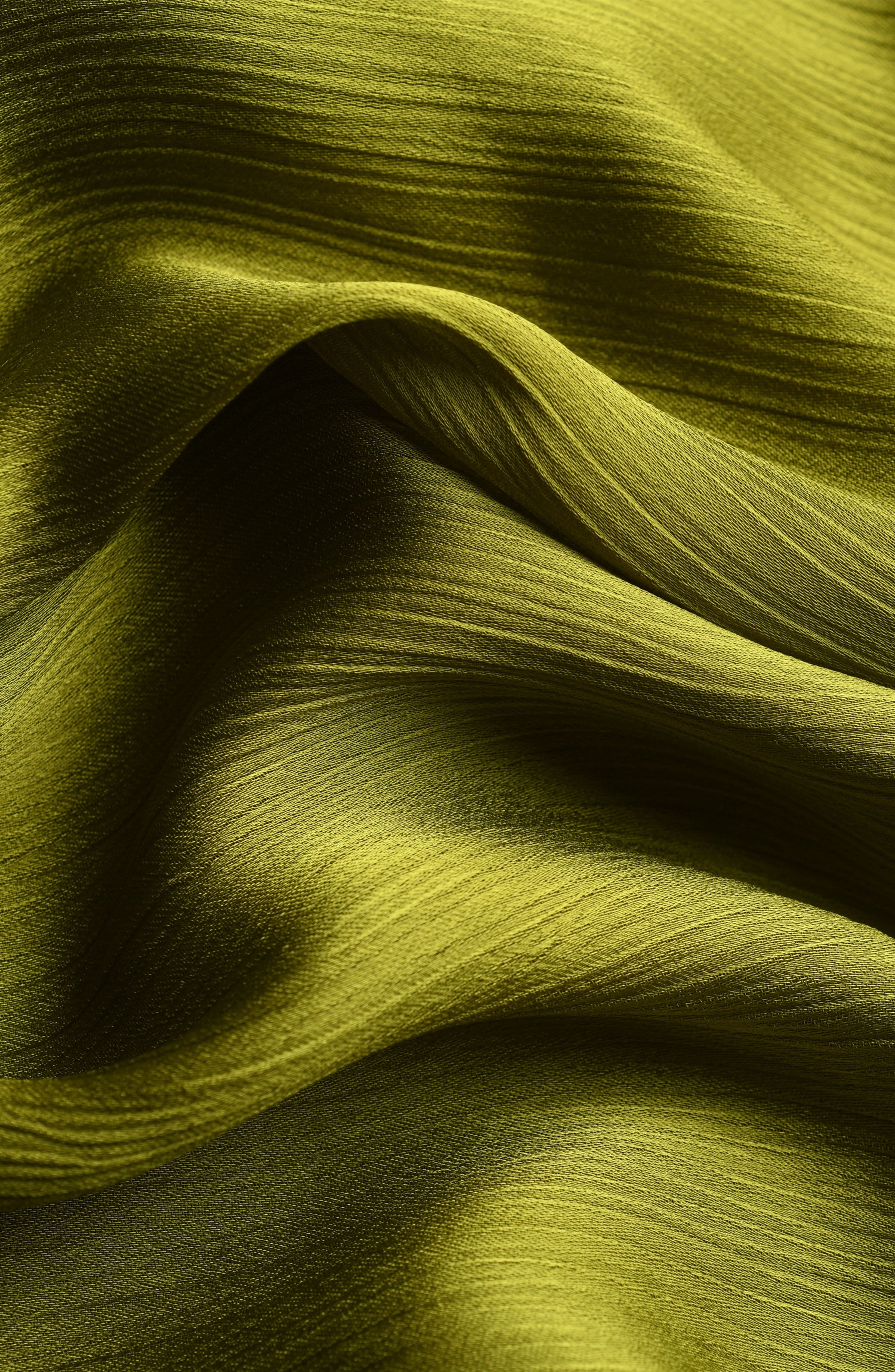 Close-up of olive green fabric with wavy texture