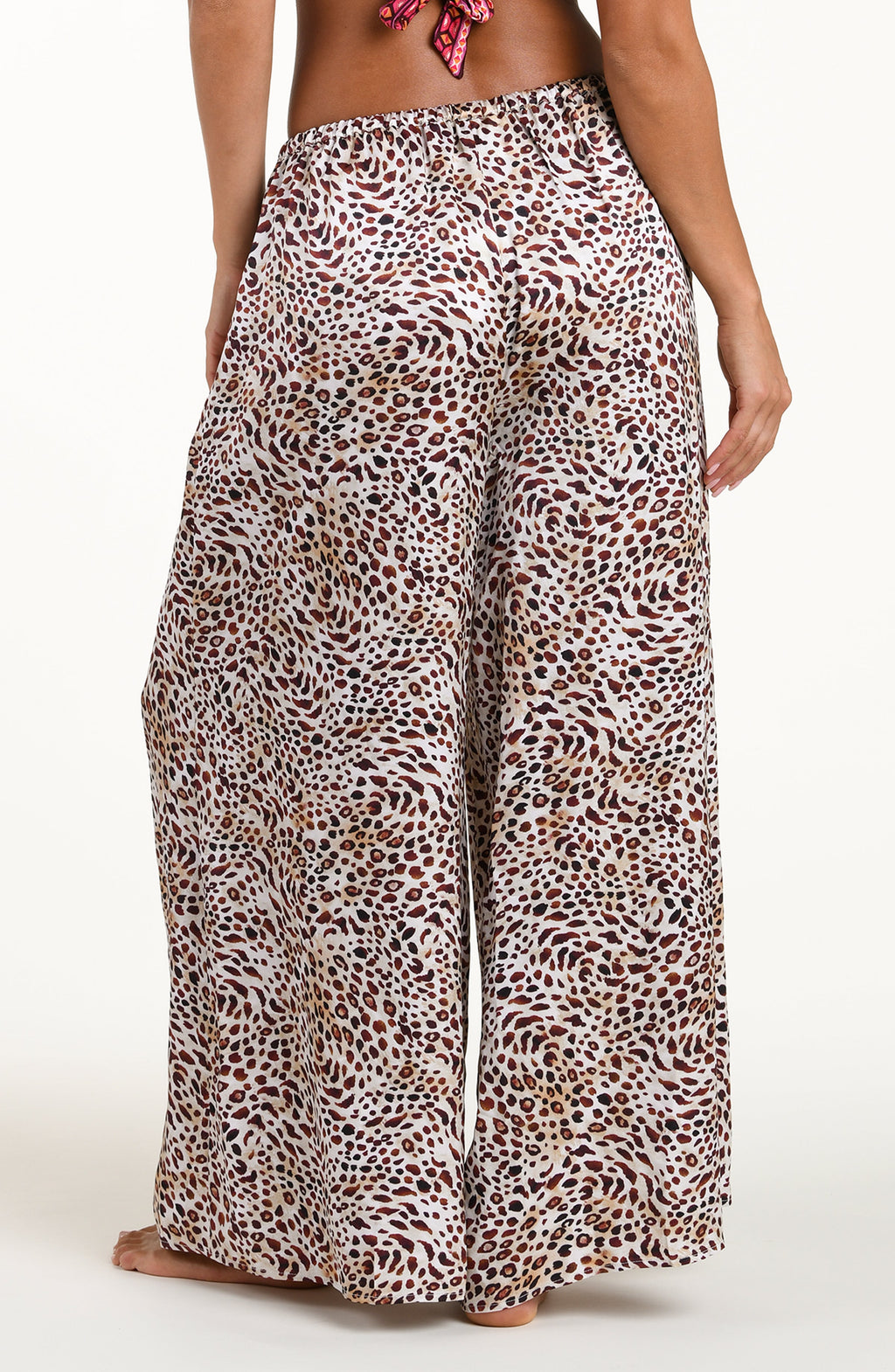 Leopard print wide-leg pants worn by a person on a white background
