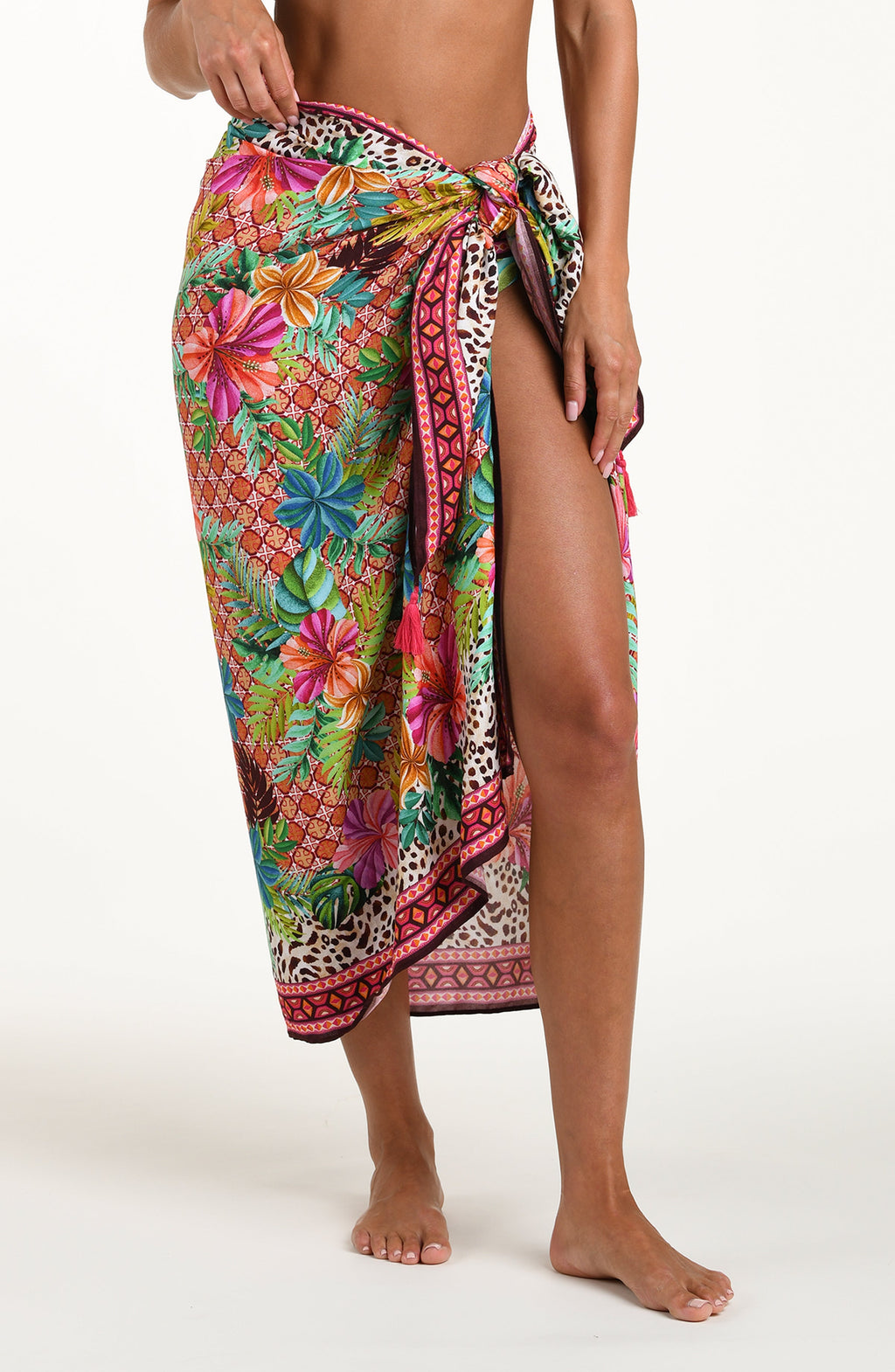 Colorful floral and animal print sarong on a white background
