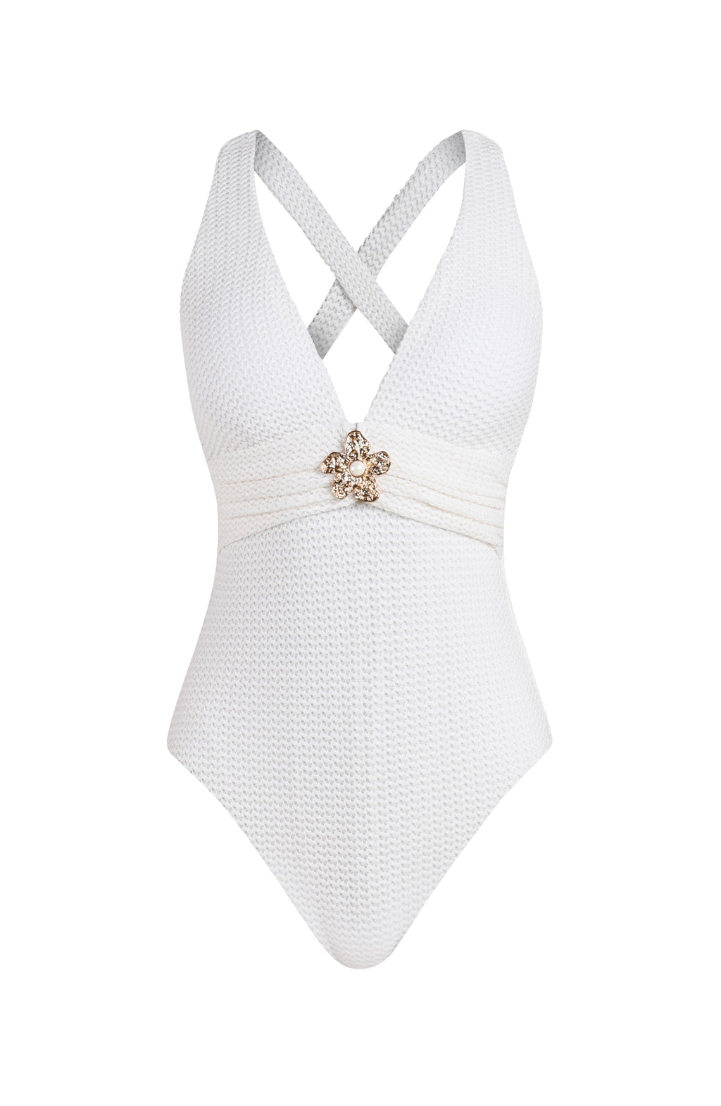 White swimsuit with a decorative brooch on a white background