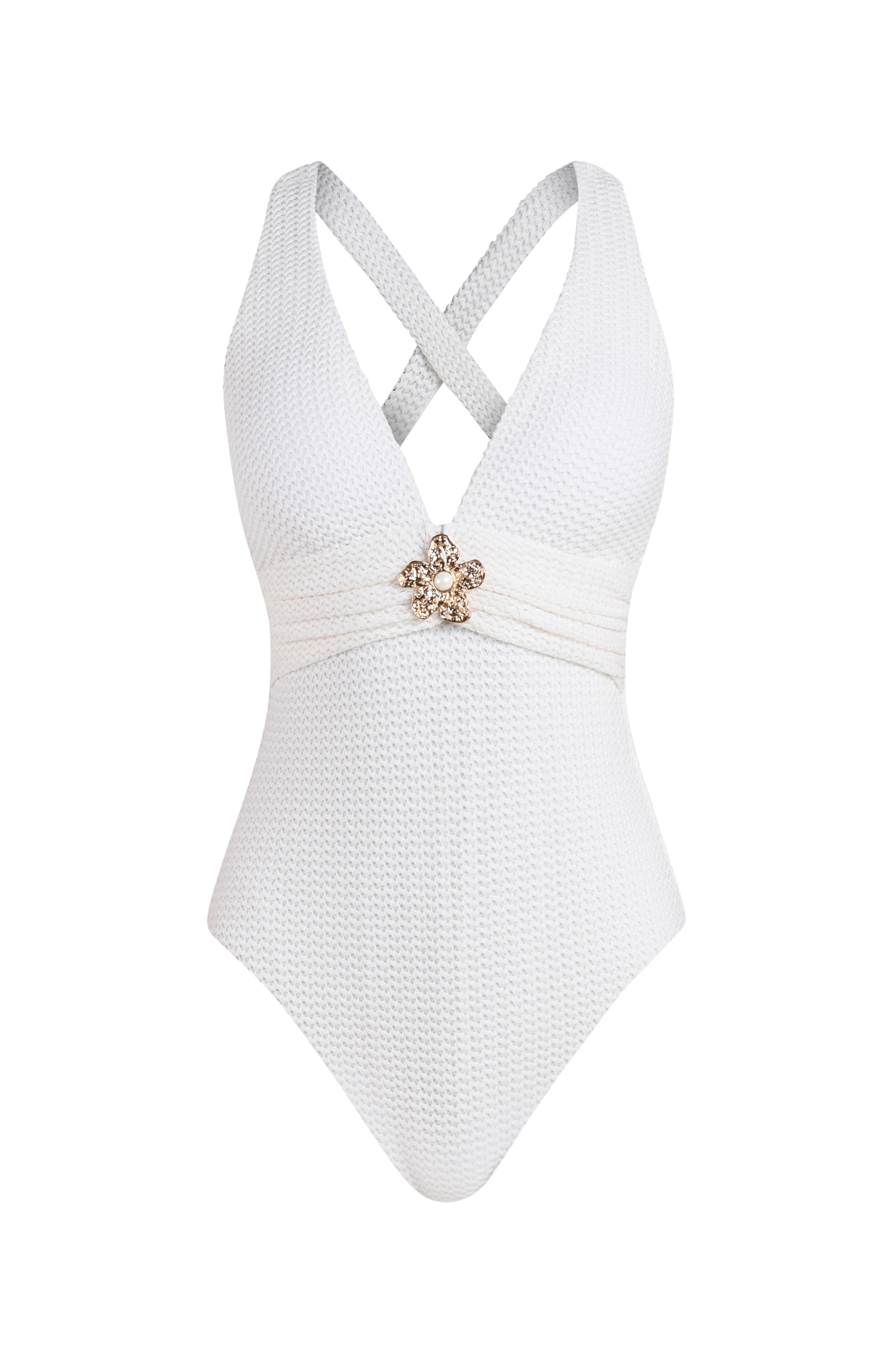White swimsuit with a decorative brooch on a white background